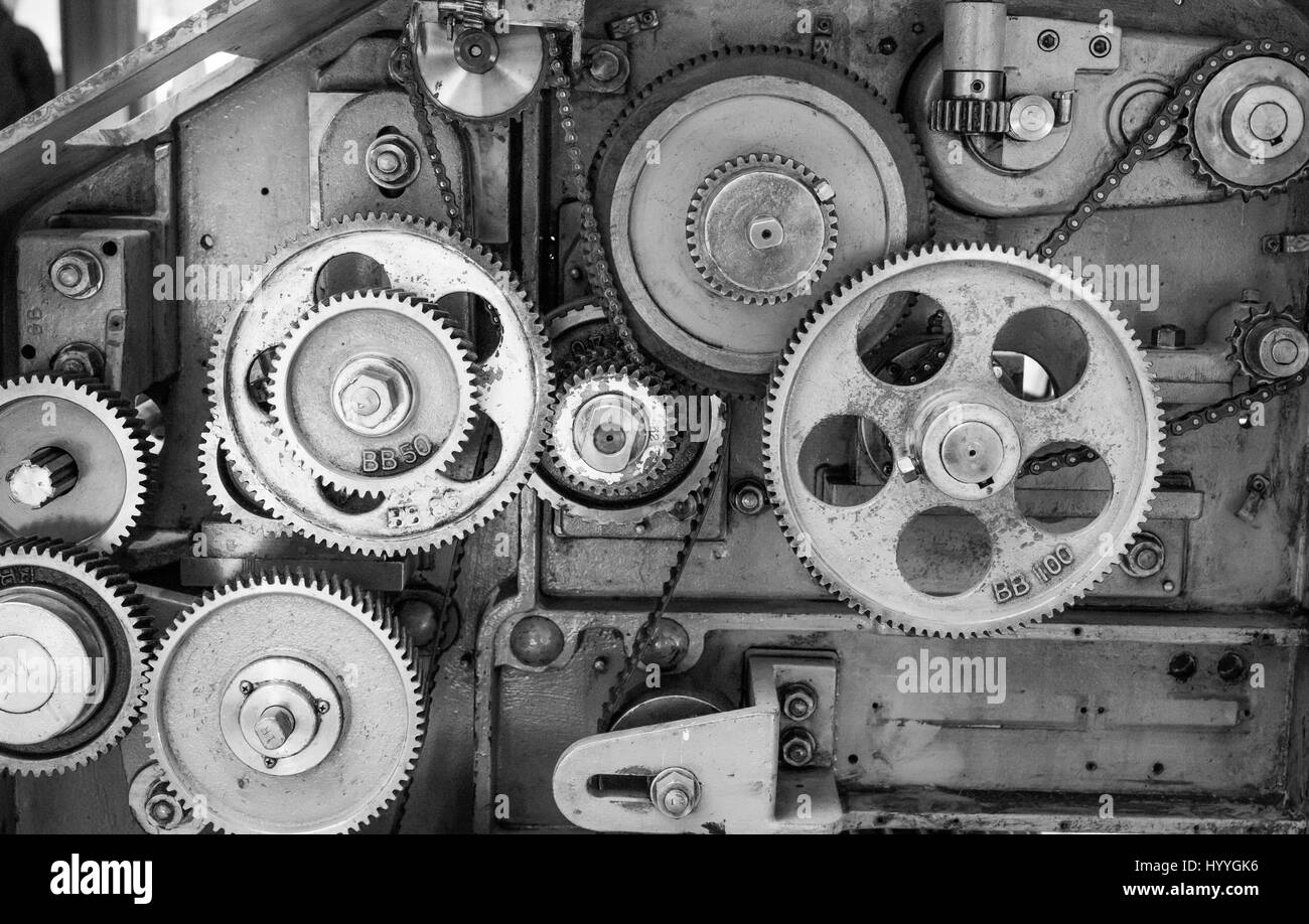 Gears inside a vintage textile machine used to produce wool and other textile products. Stock Photo