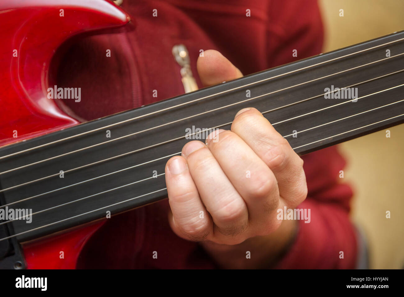 Playing Fretless Electric Guitar Stock Photo