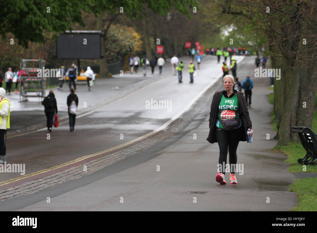 London, UK 24 April 2016. Andy walks down Greenwich park looking for her fellow NSPCC runners. Three quarters of all London Marathon competitors run for a charity, the NSPCC being the Official charity of the 2016 marathon. Approximately 38,000 runners are expected to start the run, with the London Marathon’s one millionth finisher crosing the line during this years race, a milestone in the history of the race that started in 1981. © David Mbiyu/Alamy Live News Stock Photo