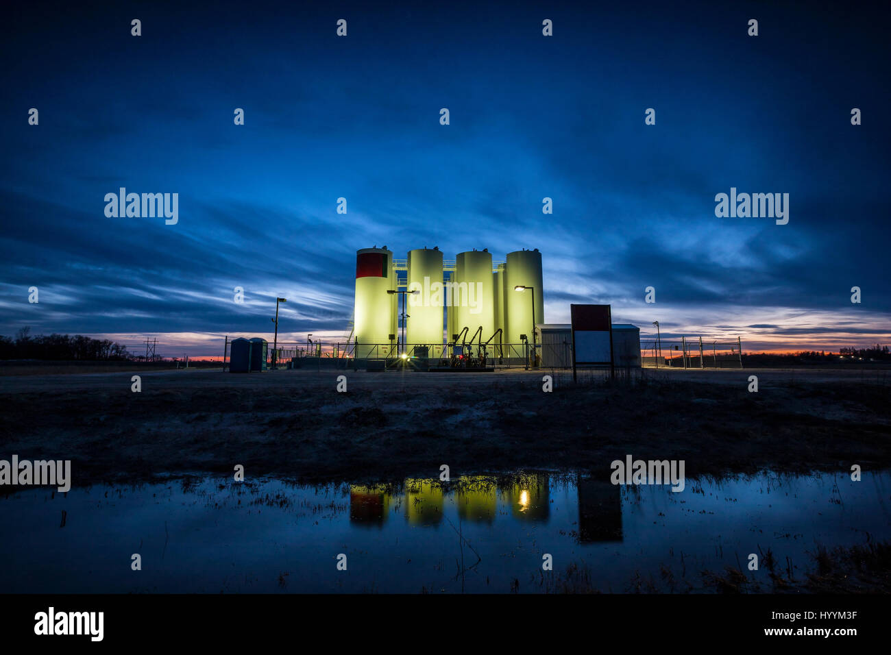Gas containers at night in Canada Stock Photo
