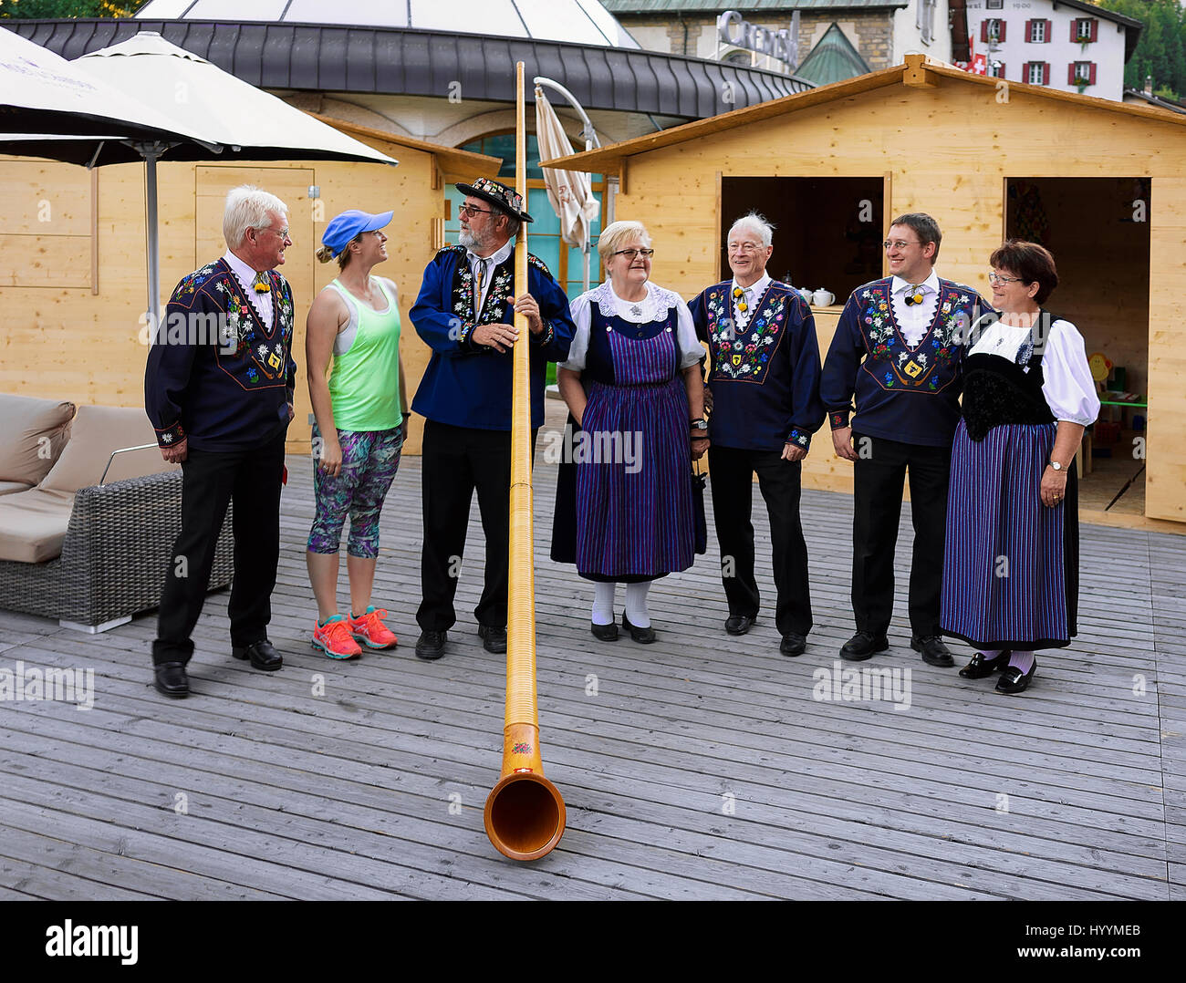 Zermatt, Switzerland - August 24, 2016: Alphorn players and senior people in traditional Swiss costumes Stock Photo