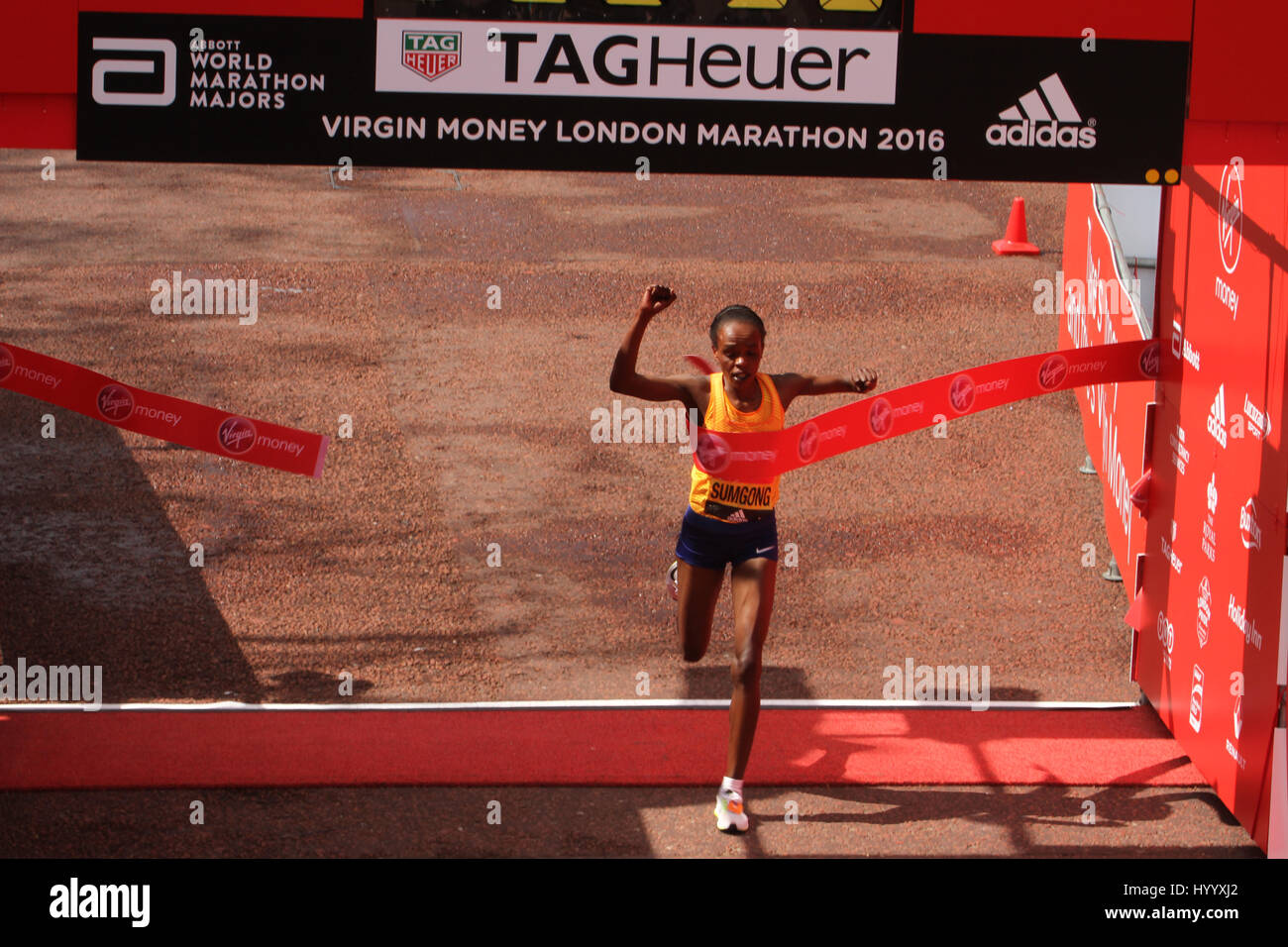 London, UK 24 April 2016. Jemima Sumgong (Kenya) wins the Virgin Money London Marathon in a time of 2:22:58. The London Marathon’s one millionth finisher will cross the line during this years race, a milestone in the history of the race that started in 1981. The men's course records is 2:04:29 (2014), held by Wilson Kipsang and women's: 2:15:25 (2003) held by Paula Radcliffe. © David Mbiyu/Alamy Live News Stock Photo
