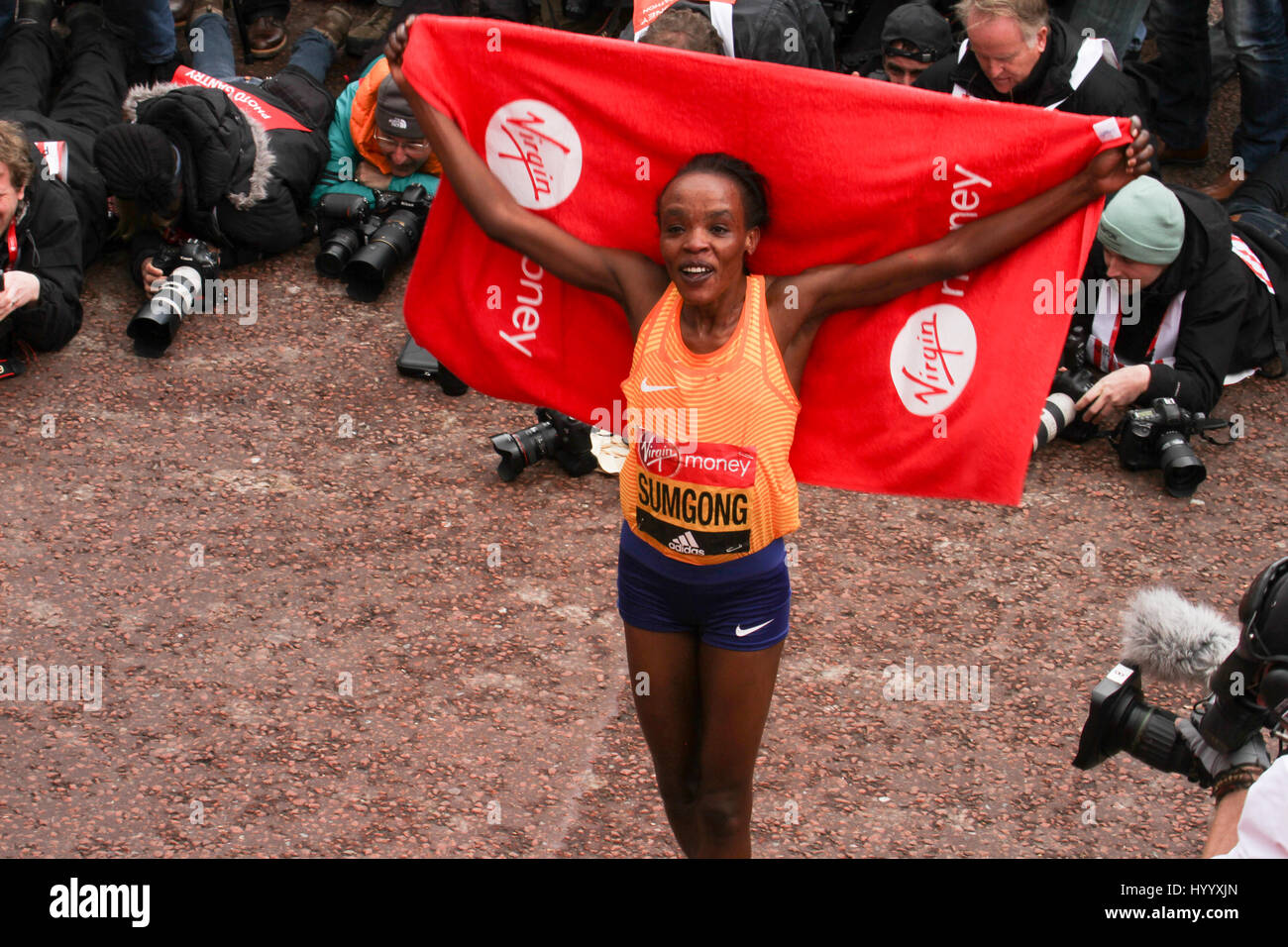 London, UK 24 April 2016. Jemima Sumgong (Kenya) poses for photos after winning the Virgin Money London Marathon in a time of 2:22:58.  The men's course records is 2:04:29 (2014), held by Wilson Kipsang and women's: 2:15:25 (2003) held by Paula Radcliffe. © David Mbiyu/Alamy Live News Stock Photo