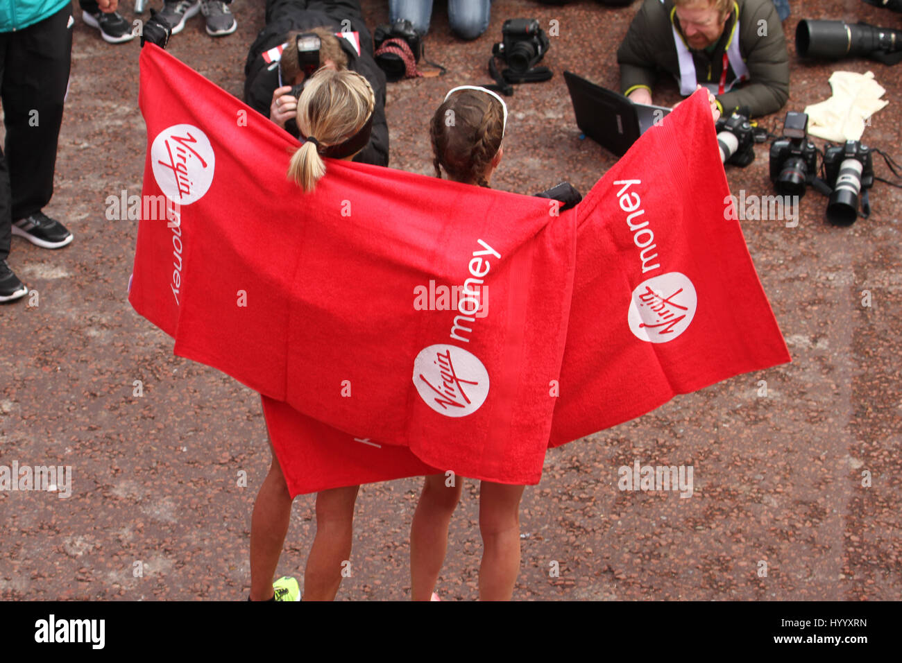 London, UK 24 April 2016. Virgin Money London Marathon female finishers pose for press photos at the Mall. The London Marathon’s one-millionth finisher will cross the line during this years race, a milestone in the history of the race that started in 1981. The men's course records is 2:04:29 (2014), held by Wilson Kipsang and women's: 2:15:25 (2003) held by Paula Radcliffe. © David Mbiyu/Alamy Live News Stock Photo