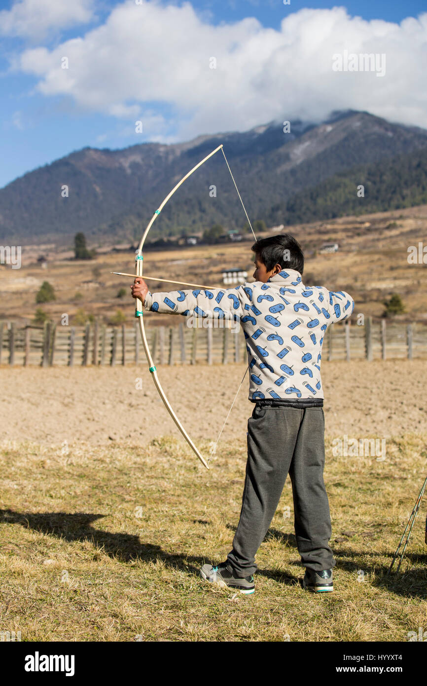 Archery, datse, is a favourite national sport of the Bhutanese. Stock Photo