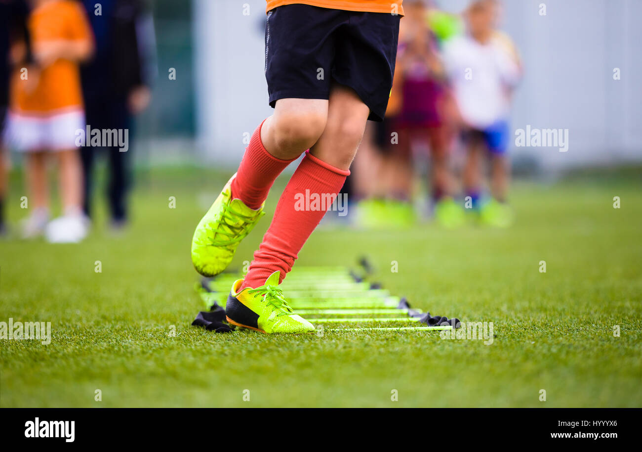 Ladder Drills Exercises for Football Soccer Team. Young Player