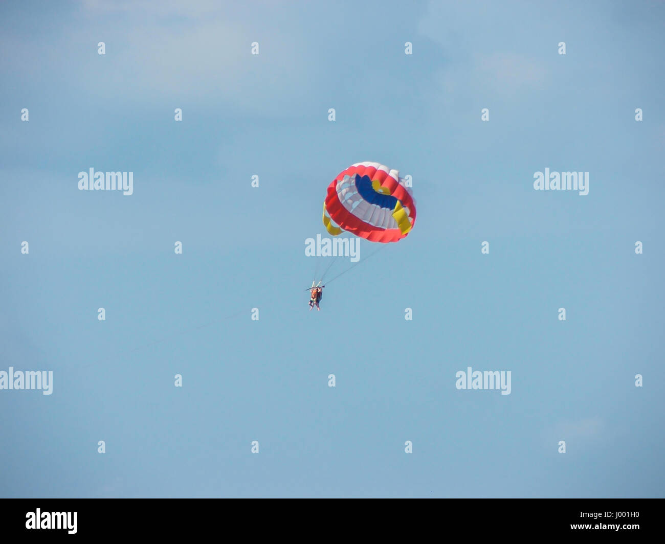 Parasailing behind a boat with a tow rope is a fun and unique activity