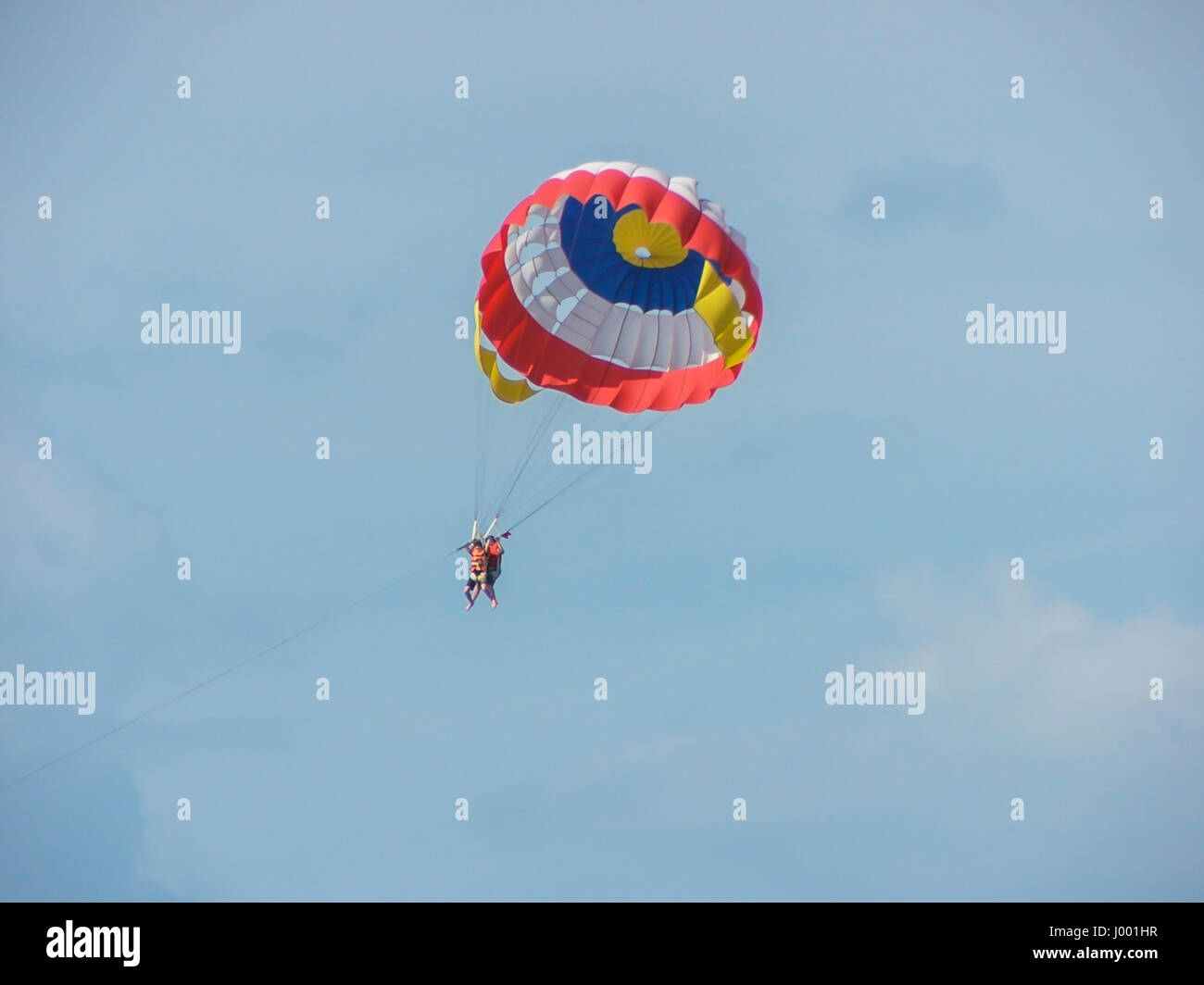 Parasailing behind a boat with a tow rope is a fun and unique activity