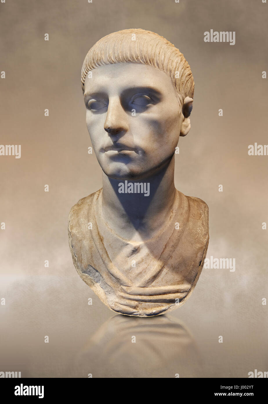 Roman portrait bust of a young man with the hairstyle from the rule of Trajan 98-117 AD. National Roman Museum, Rome, Italy Stock Photo