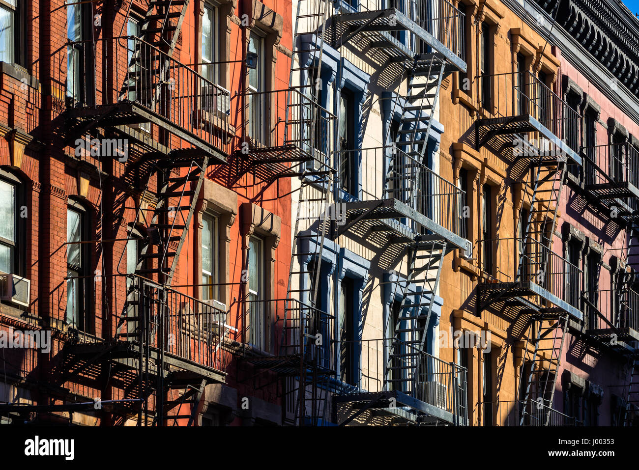 Colorful Soho building facades with painted fire escapes. Manhattan, New York City Stock Photo