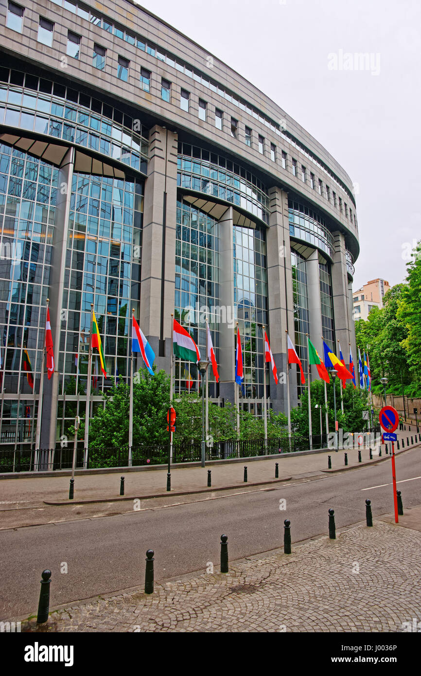 Brussels, Belgium - May 11, 2012: EU Parliament building and flags in Brussels, capital of Belgium. Stock Photo