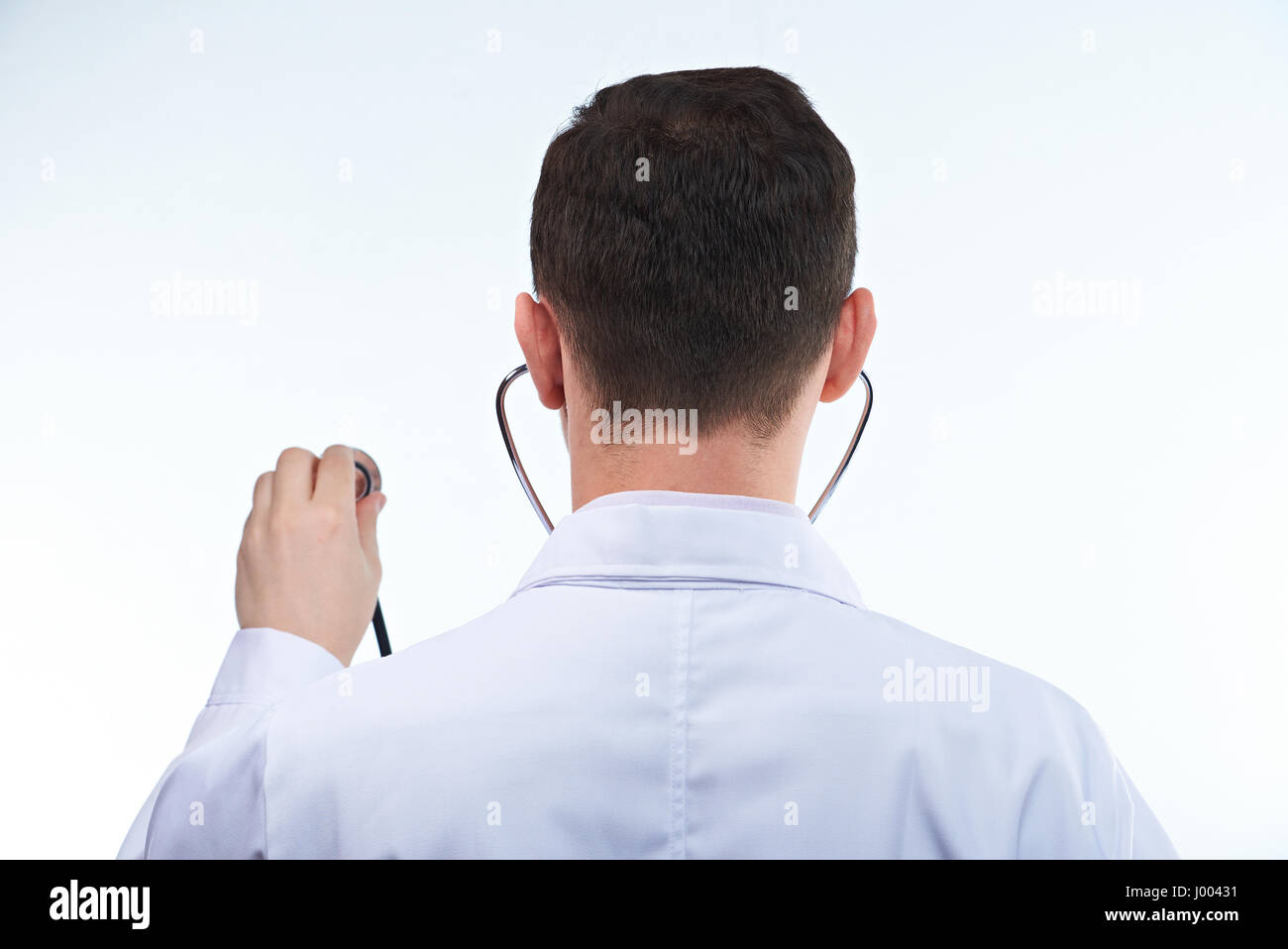 Back of doctor with stethoscope isolated on white background Stock Photo