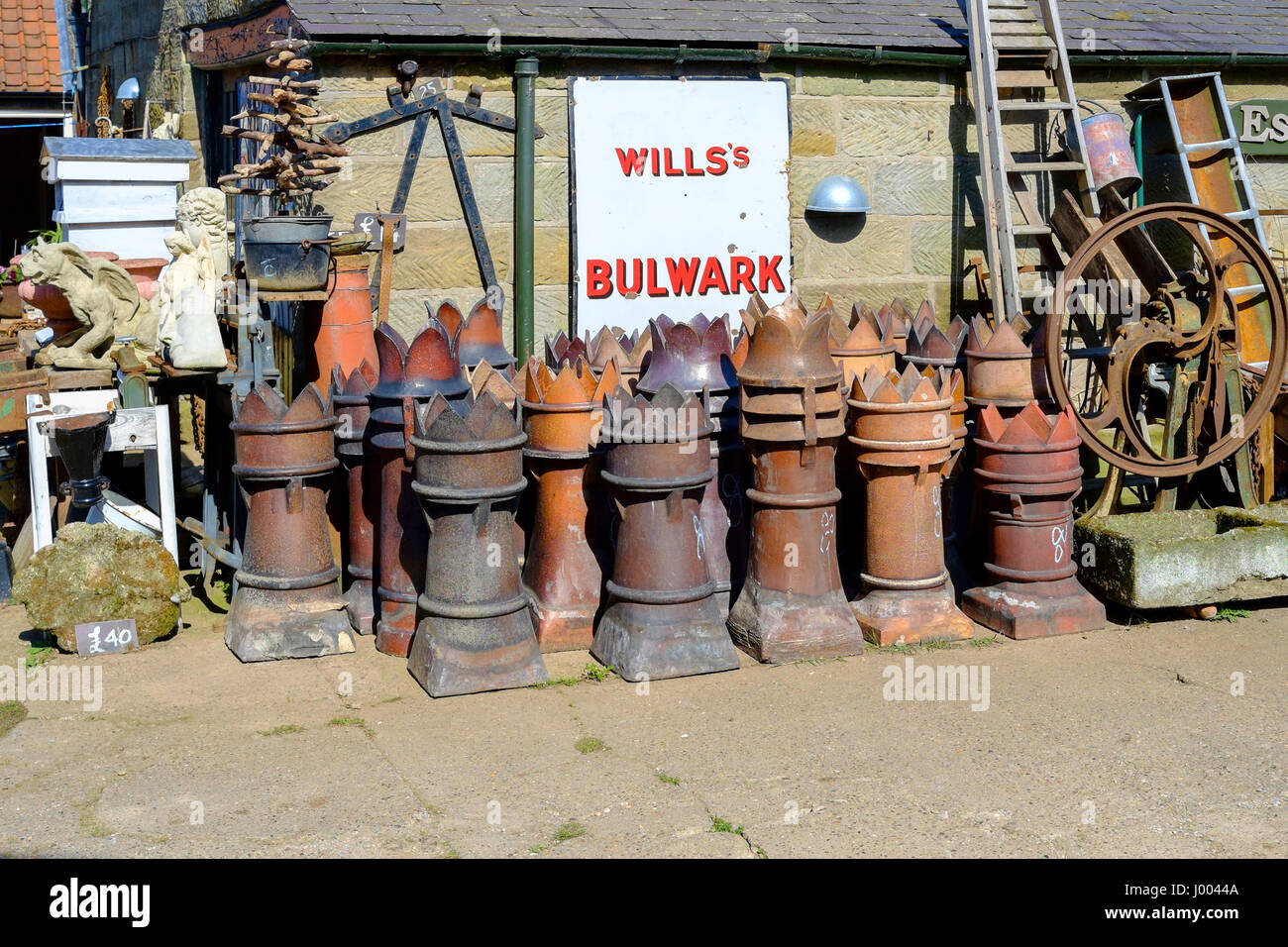 Old fashioned recovered chimney pots for sale in an Antique business in North Yorkshire as garden ornaments or planters Stock Photo