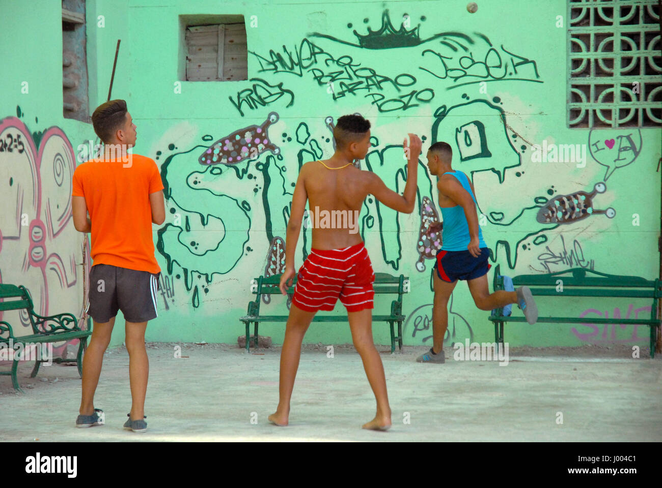 Young men playing handball on the streets of Havana, Cuba. Stock Photo