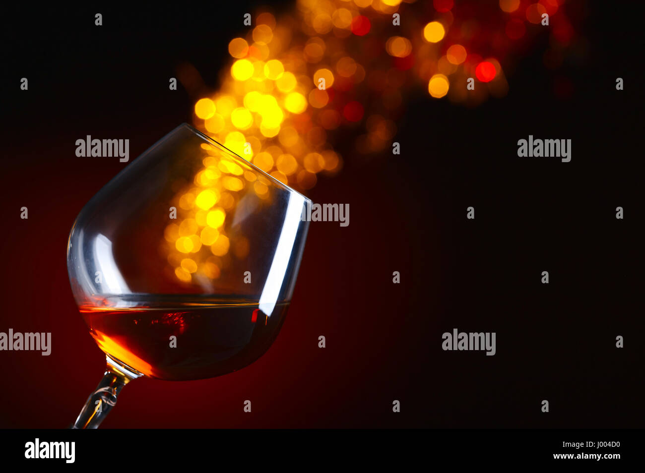 Snifter of brandy on a dark background . Natural background Stock Photo