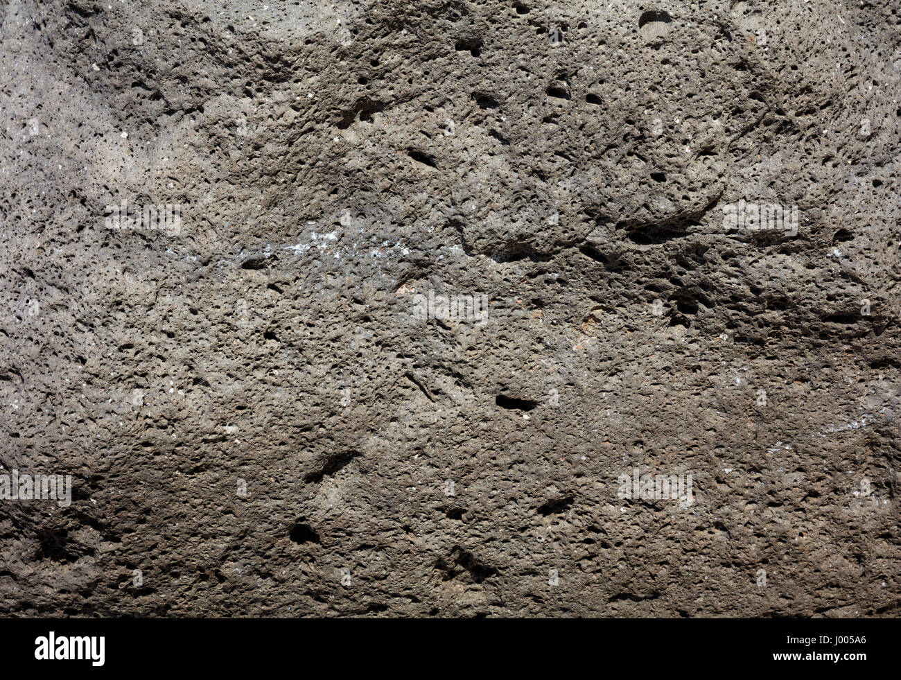 Dark grey volcanic stone as background Stock Photo - Alamy