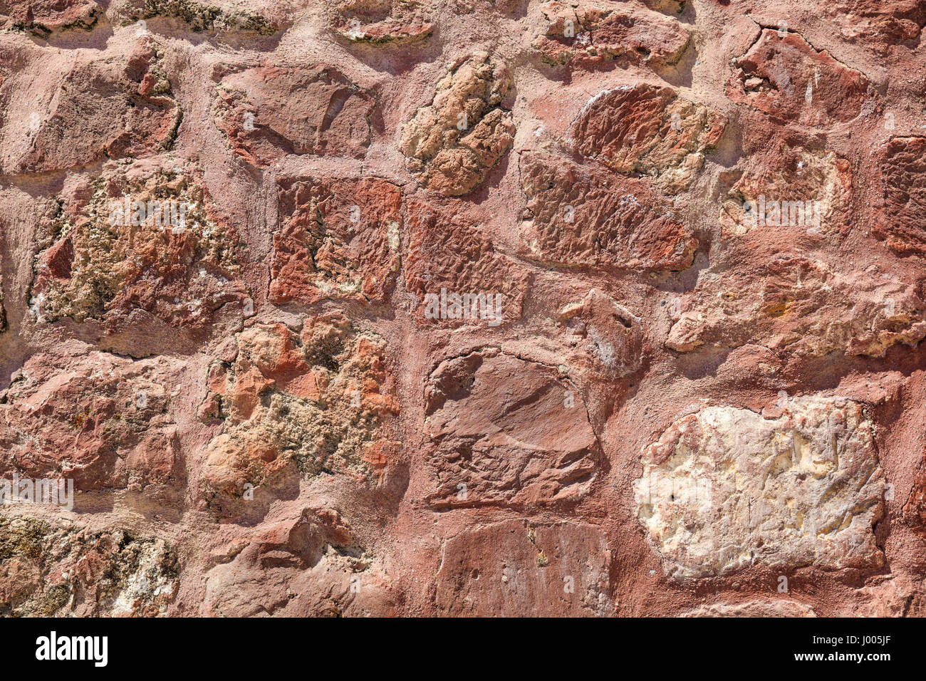 Red rock stones background. Exterior house wall Stock Photo - Alamy