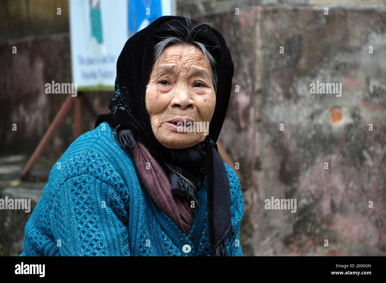 NINH BINH,VIETNAM - FEBRUARY 21, 2013: Elderly Vietnamese woman with a scarf living in the rural areas of Ninh Binh, Vietnam Stock Photo