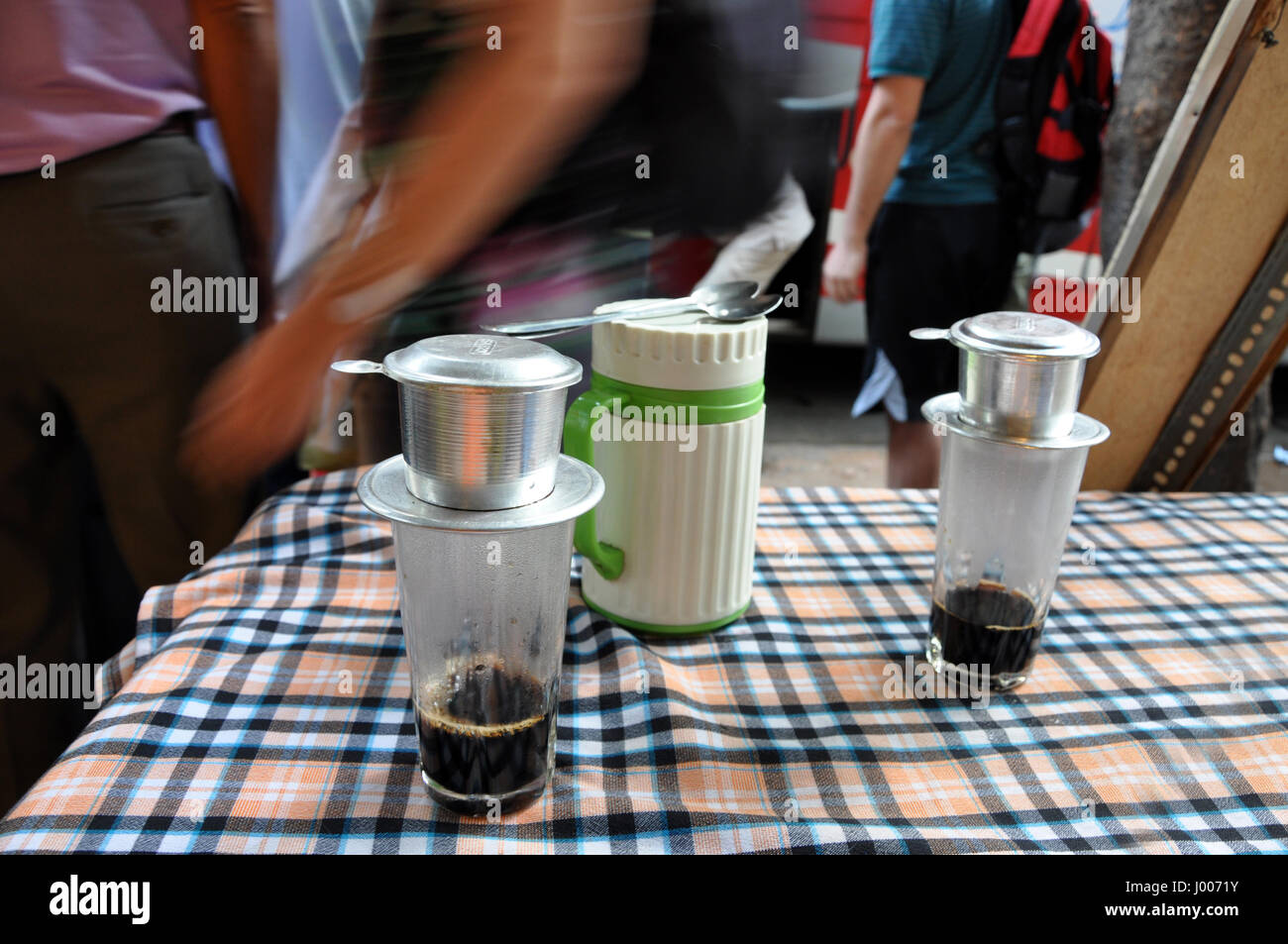 Brewing Vietnamese coffee with a singlecup filter. Phin traditional Vietnamese coffee maker