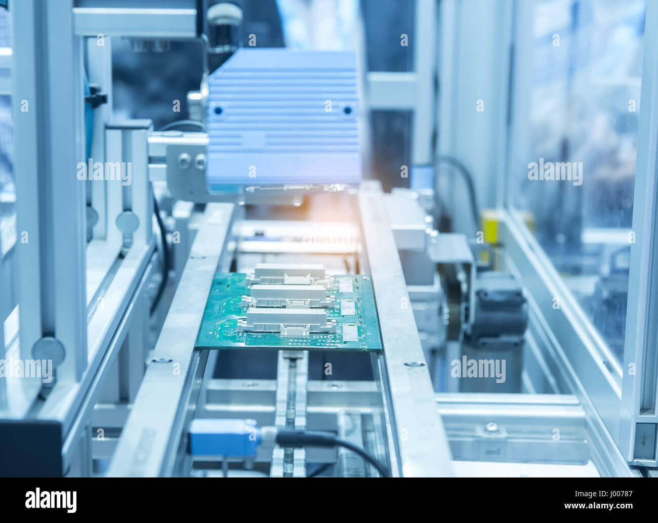 industrial machine robot in assembly line working in factory. Smart factory industry 4.0 concept. Stock Photo