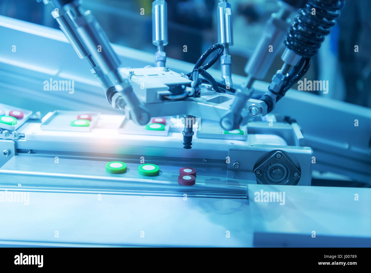 industrial machine robot in assembly line working in factory. Smart factory industry 4.0 concept. Stock Photo