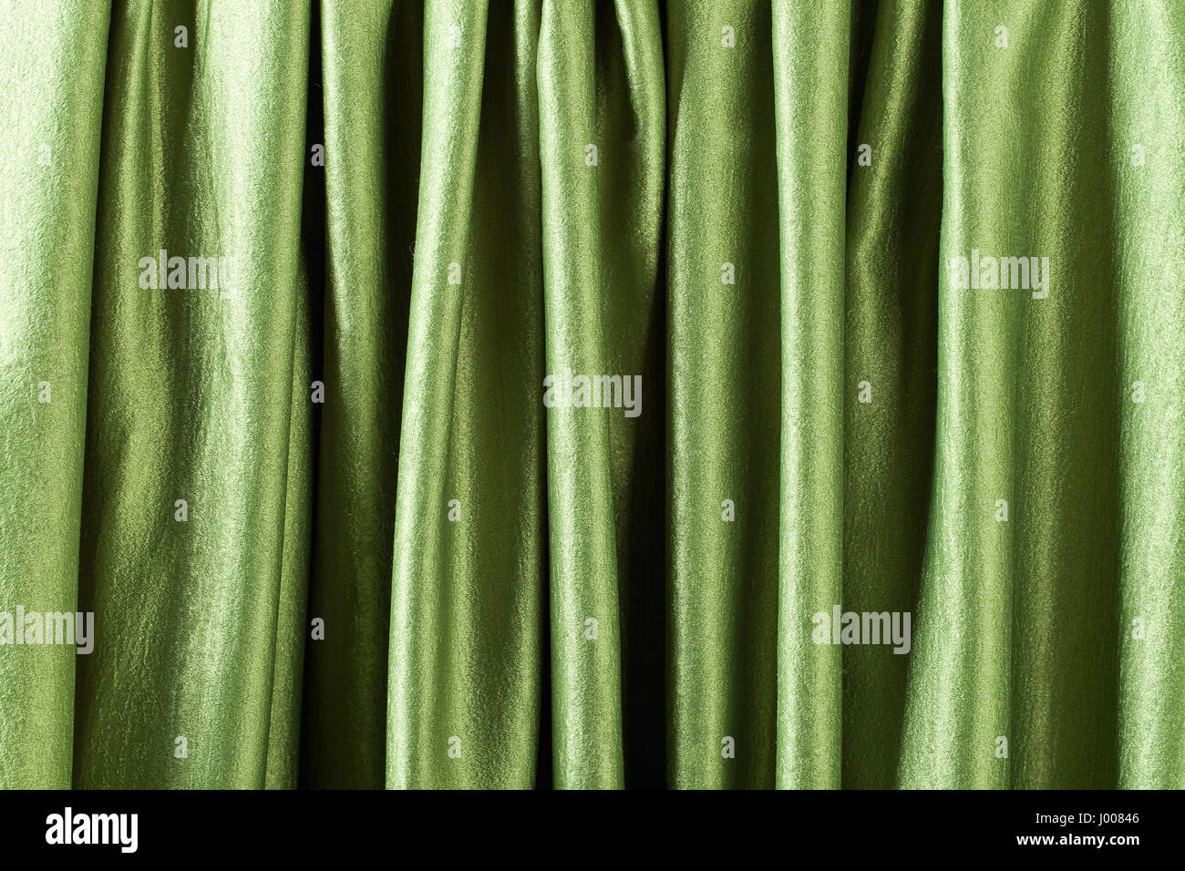 Smooth elegant green satin or silk .Cloth texture can use as background ...