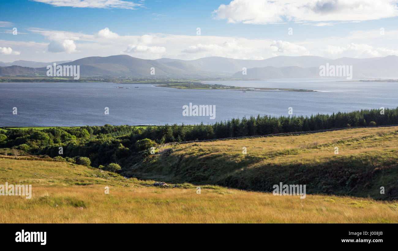 Cromane Point, a small peninsula in Dingle Bay, with the Macgillycuddy's Reeks mountains behind, on the Iveragh Peninsula of County Kerry in Ireland. Stock Photo