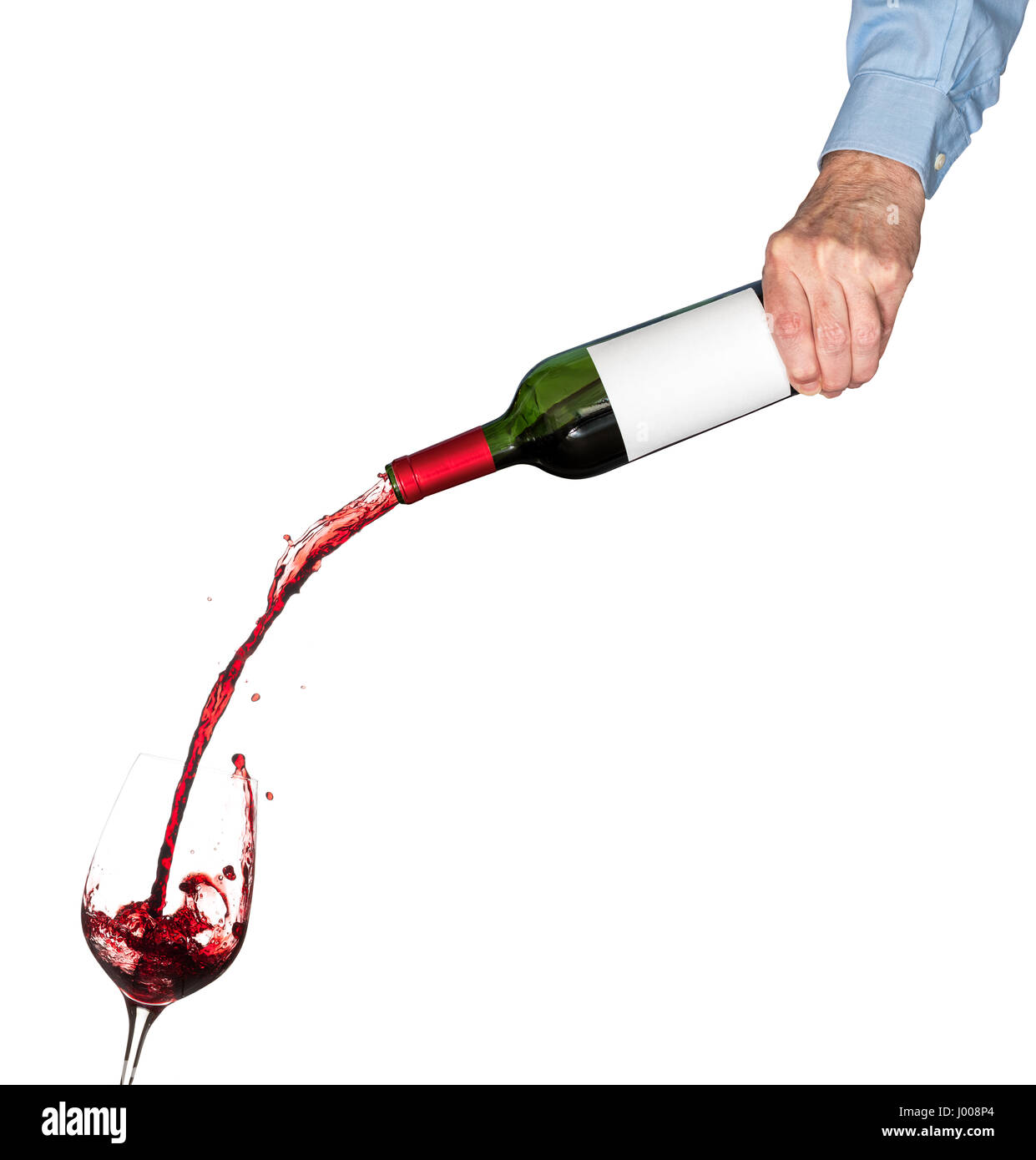 Cork from red wine bottle in front of glass of wine and green bottle out of...
