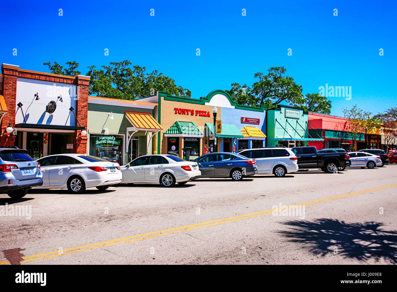Vehicles parked along Main Street in downtown Dunedin, Florida Stock Photo