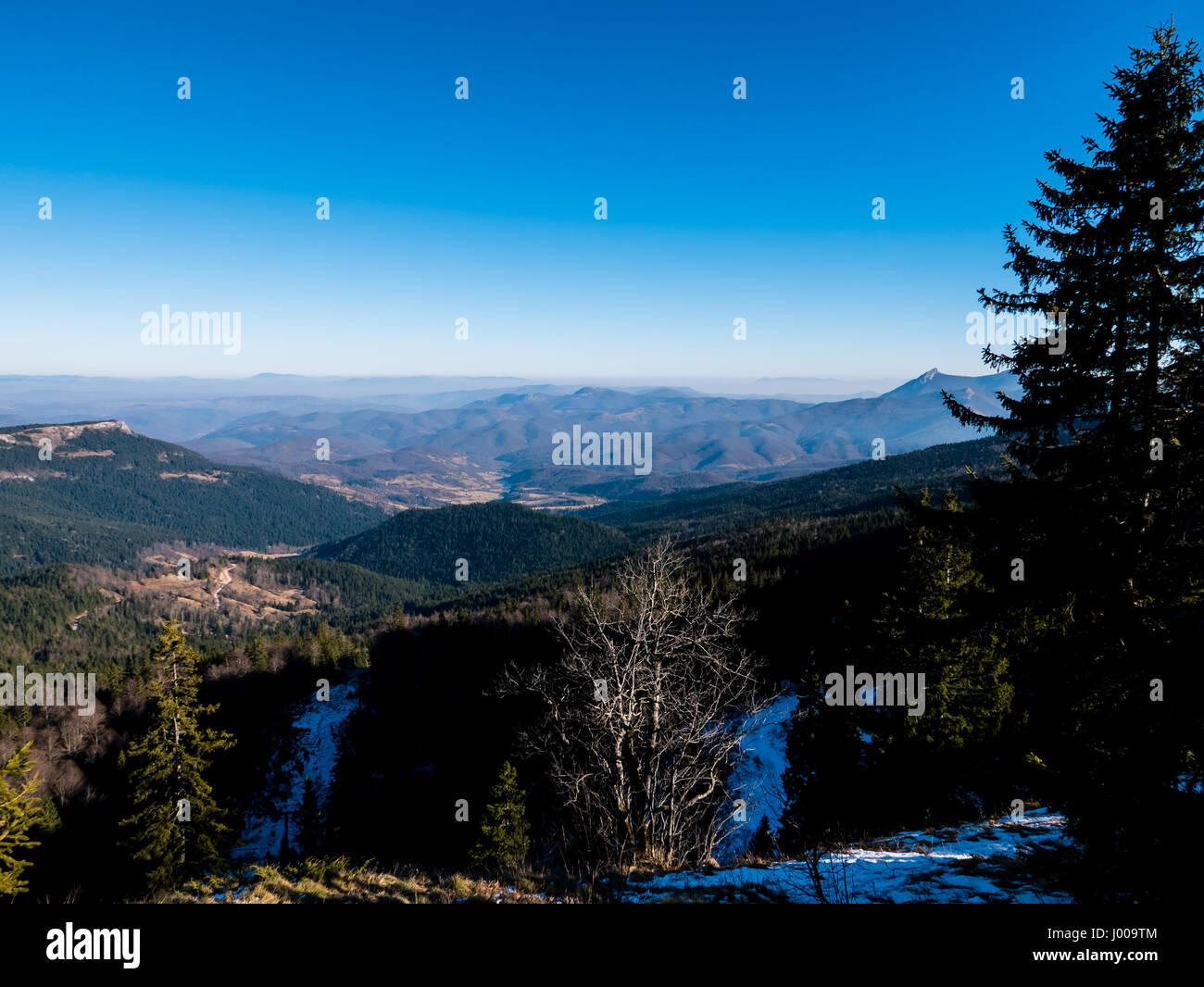 Mountain landscape in winter with blue sky above Stock Photo