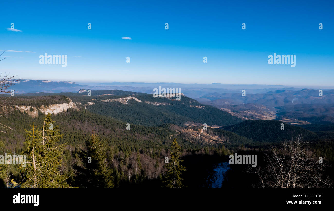 Mountain landscape in winter with blue sky above Stock Photo