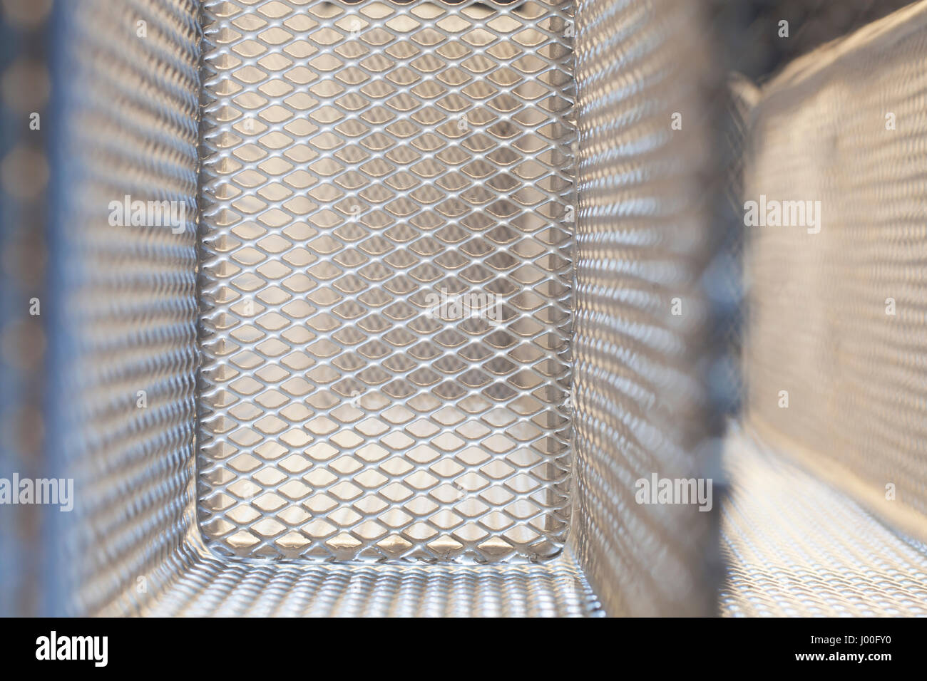 Abstract closeup of the mesh of a metal cage Stock Photo