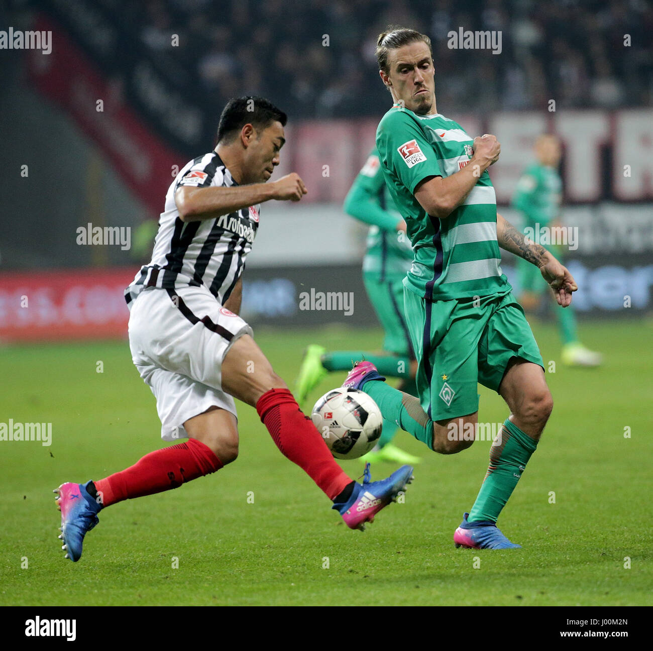 Frankfurt's Marco Fabian (L) and Bremen's Max Kruse (R) vie for the ball during the German Bundesliga soccer match between Eintracht Frankfurt and Werder Bremen in the Commerzbank-Arena in Frankfurt am Main, Germany, 07 April 2017. Photo: Hasan Bratic/dpa Stock Photo