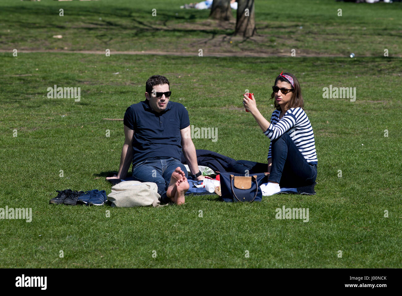 Lonodon, UK. 08th Apr, 2017. People enjoy sunny weather in the park. 08th Apr, 2017. People having fun in Hyde Park, London. Credit: Sebastian Remme/Alamy Live News Stock Photo