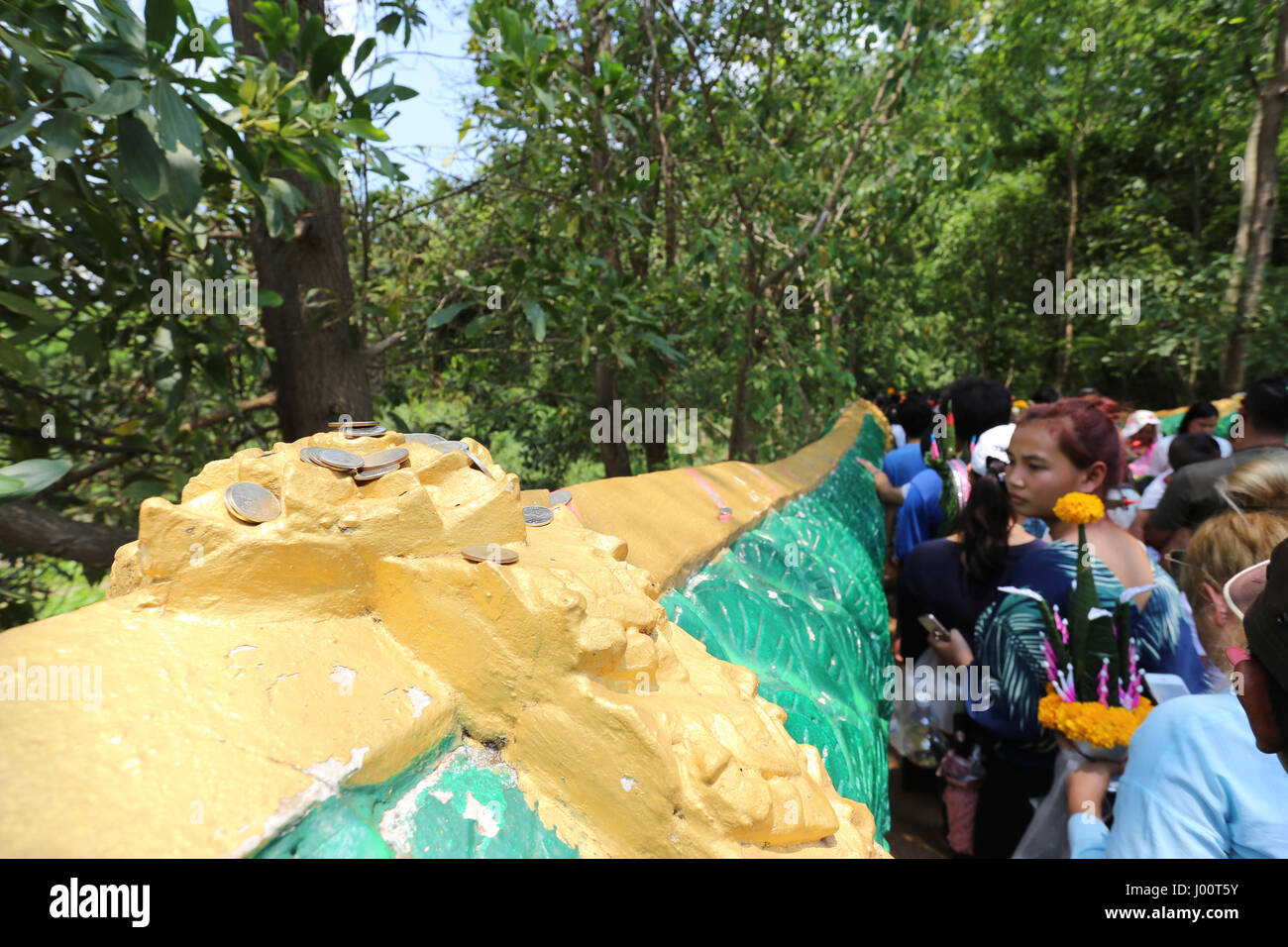 Coins are deposited on the stone Naga Serpent railing Stock Photo - Alamy