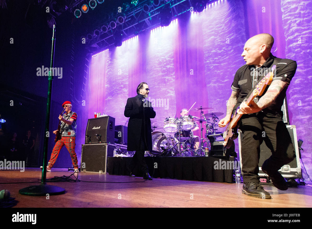 San Diego, California. April 7, 2017. Bassist Stu West  performs with the Damned at the House of Blues. Behind him are guitarist Captain Sensible, singer Dave Vanion, and drummer Pinch. Originally formed in 1976 in London, The Damned is on their 40th anniversary tour. Stock Photo