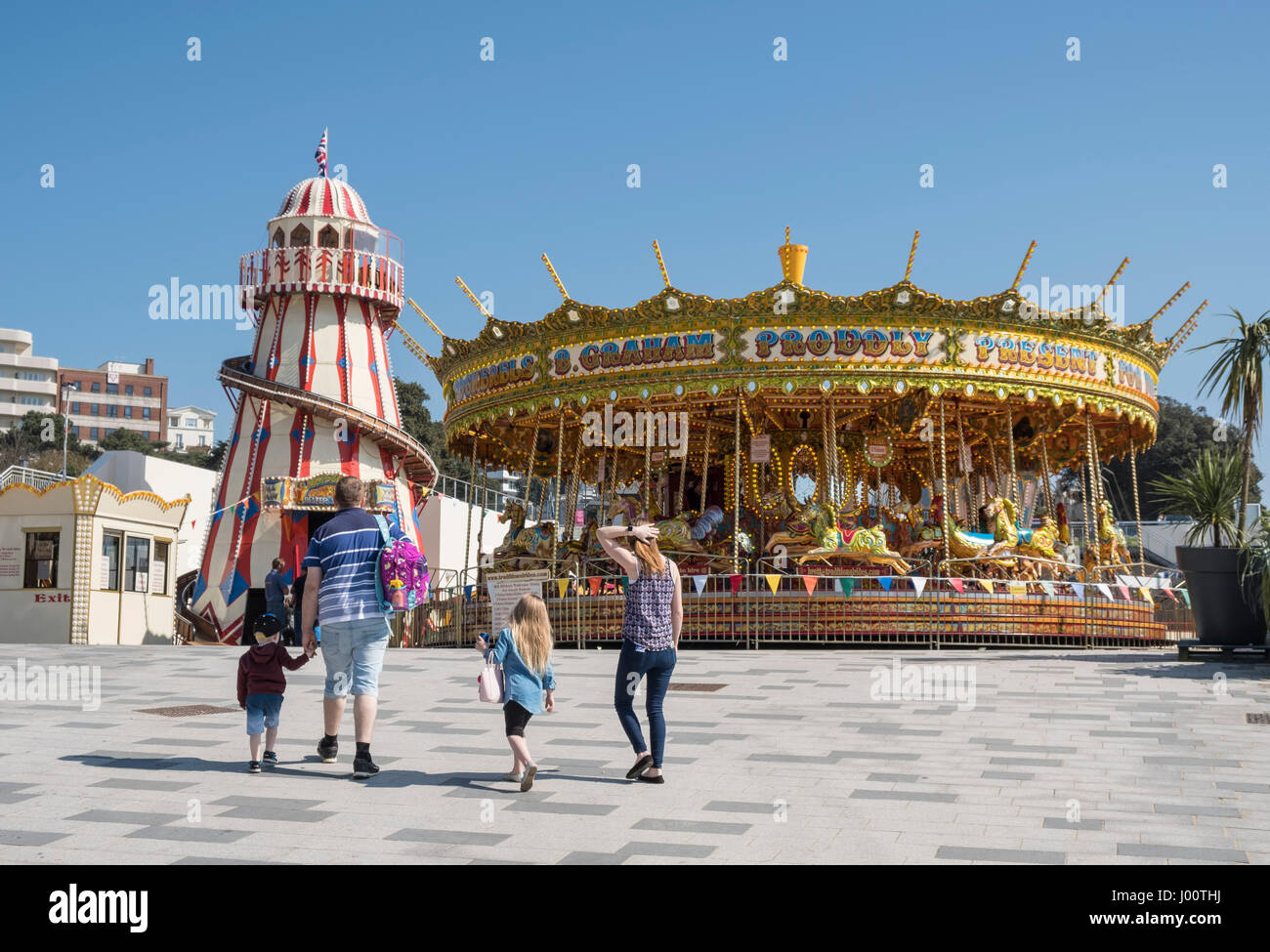 Merry-go-round or Carousel and Victorian Helter-skelter Spiral Slide for children in Bournemouth, Dorset, UK Stock Photo