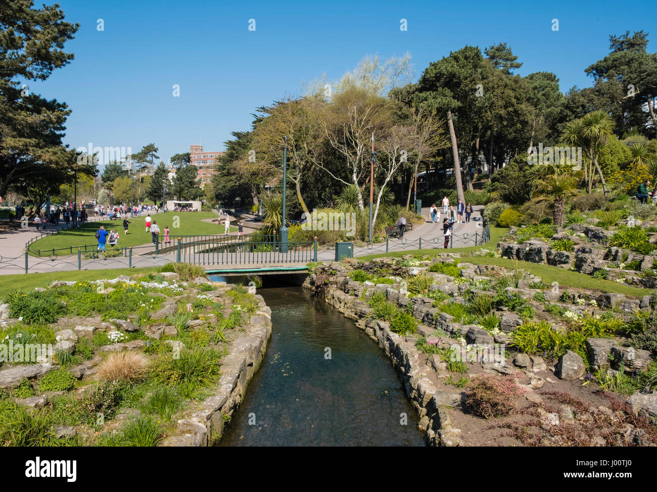 Bournemouth Lower Gardens with the River Bourne going through a landscaped rock garden, Dorset, UK Stock Photo