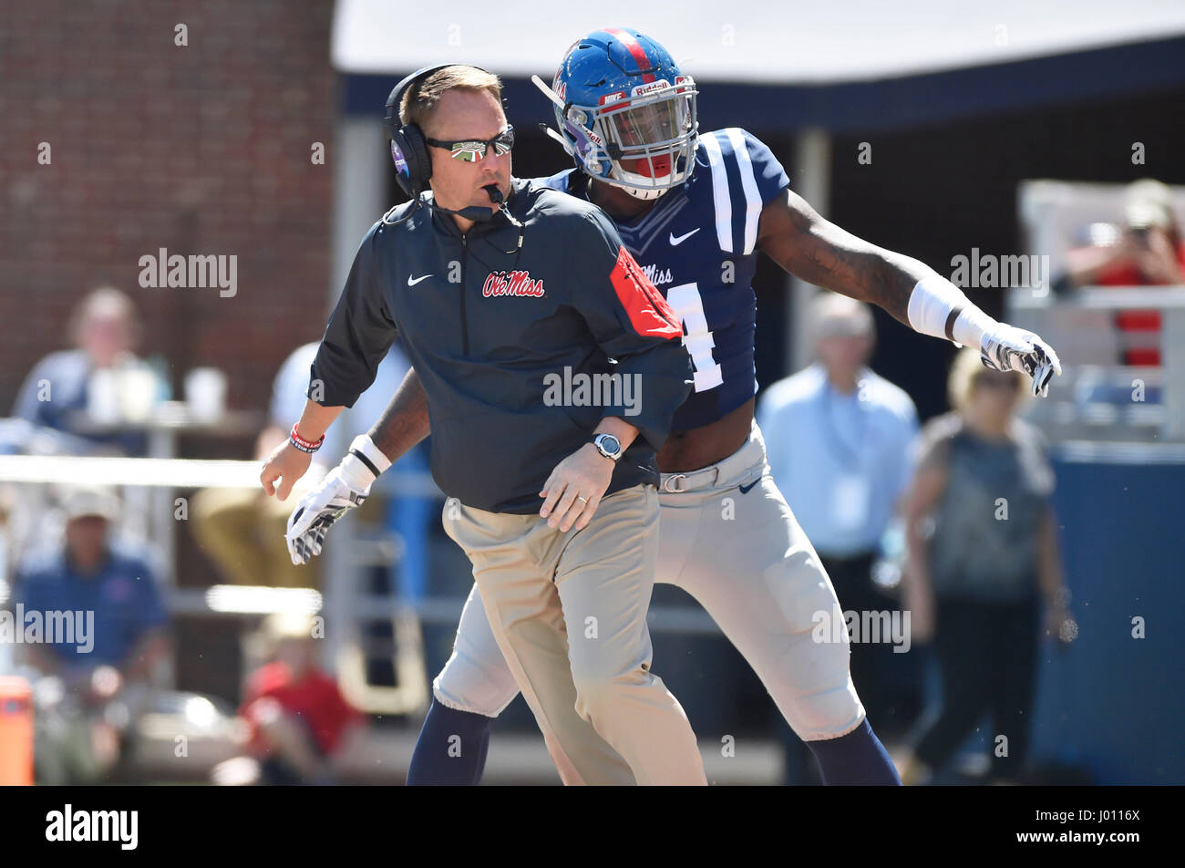 Oxford, MS, USA. 8th Apr, 2017. Mississippi defensive end Victor Evans (right) tries to keep from running into coach Hugh Freeze (left) during the second quarter of an NCAA college football spring game at Vaught-Hemmingway Stadium in Oxford, MS. The Red team won 31-29. Austin McAfee/CSM/Alamy Live News Stock Photo