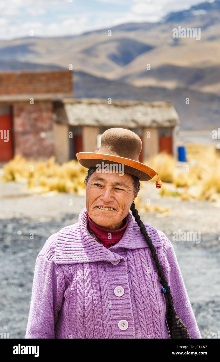 Local native Peruvian woman wearing unusual local style of hat, Lake Lagunillas Puno District, Lampa Province, near the Colca Canyon, Altiplano, Peru Stock Photo