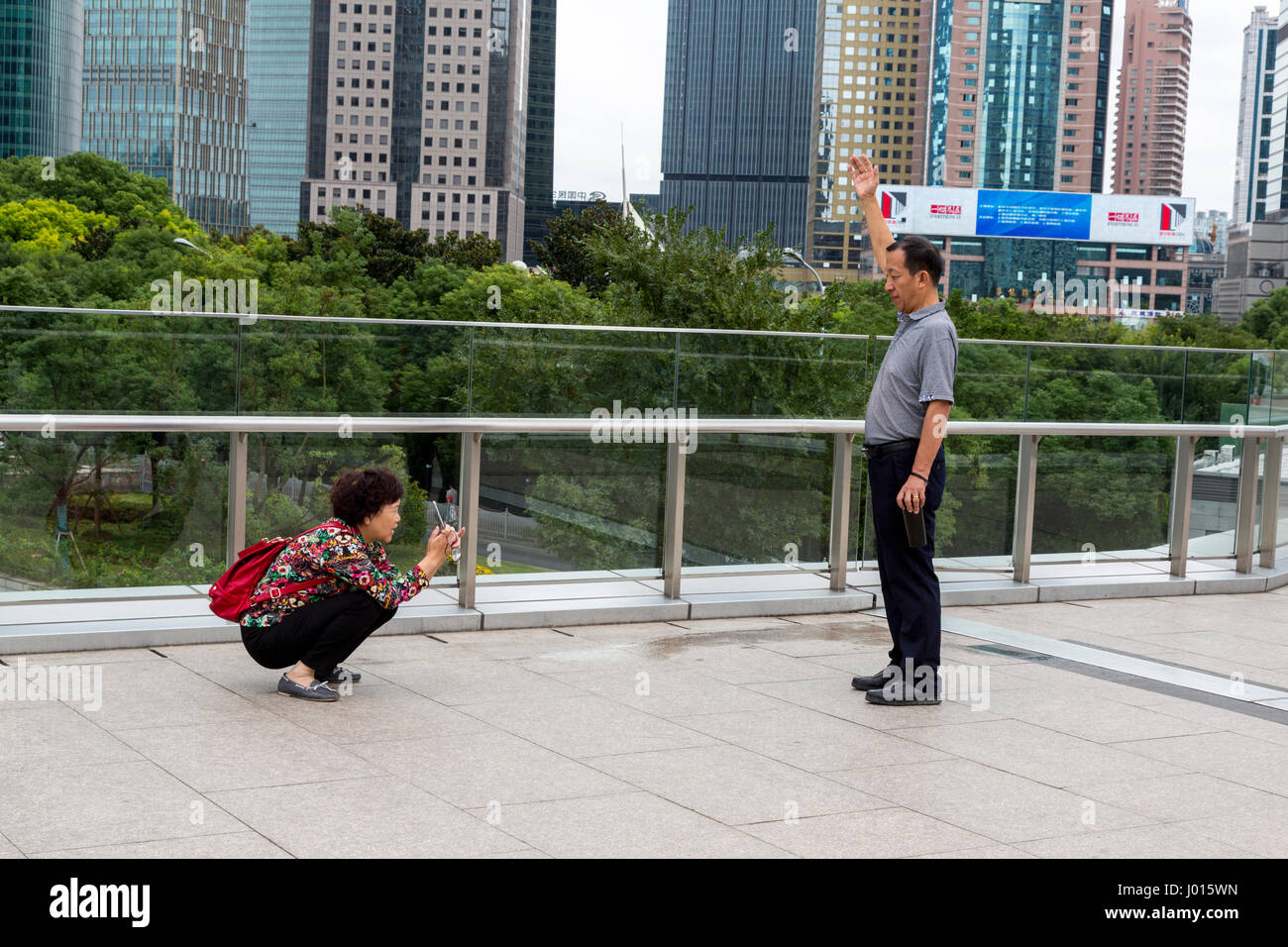 China, Shanghai.  Chinese Tourists Taking Pictures. Stock Photo