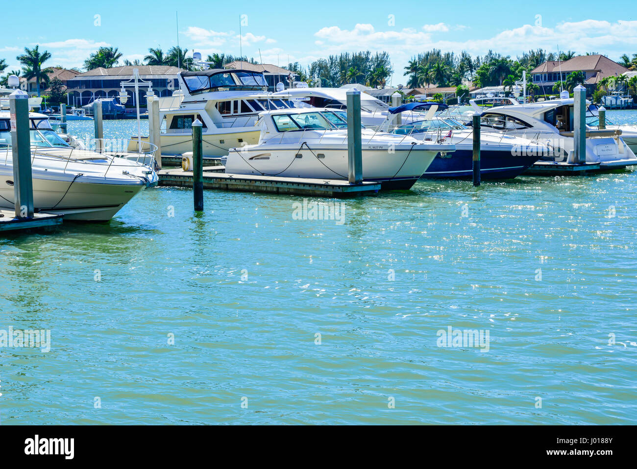 Cabin Cruisers, boats and yachts, docked on Smokehouse Bay's blue green