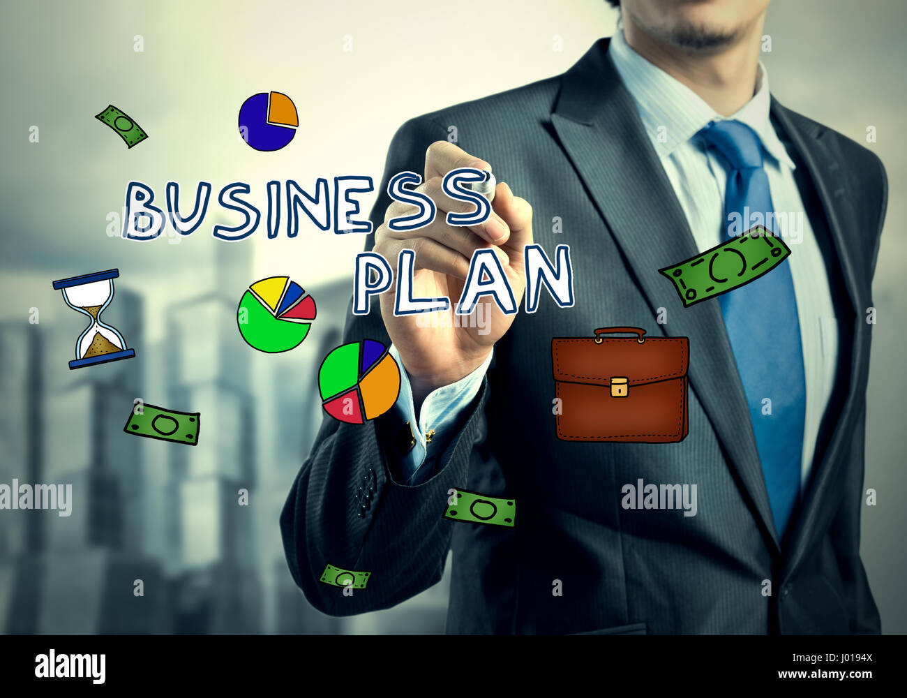 Businessman drawing business icons Stock Photo