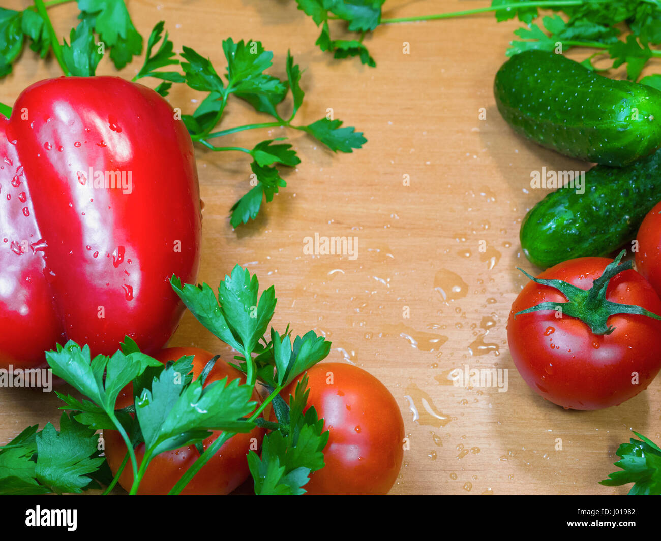 Fresh bulgarian peppe, vegetables and herbs on the table Stock Photo
