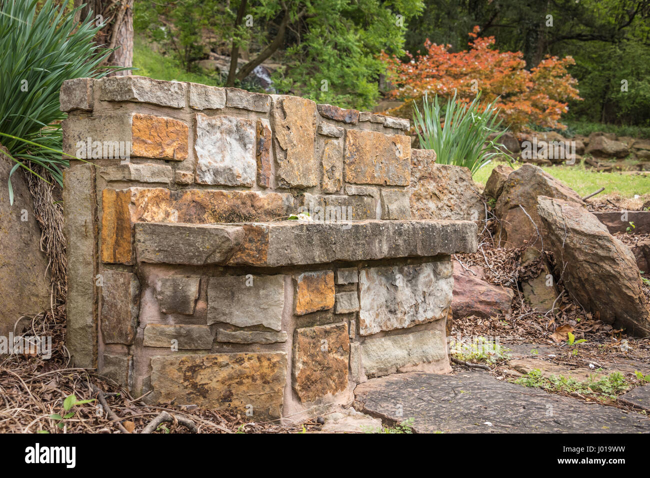 Stone bench at Honor Heights Park in Muskogee, Oklahoma, USA Stock