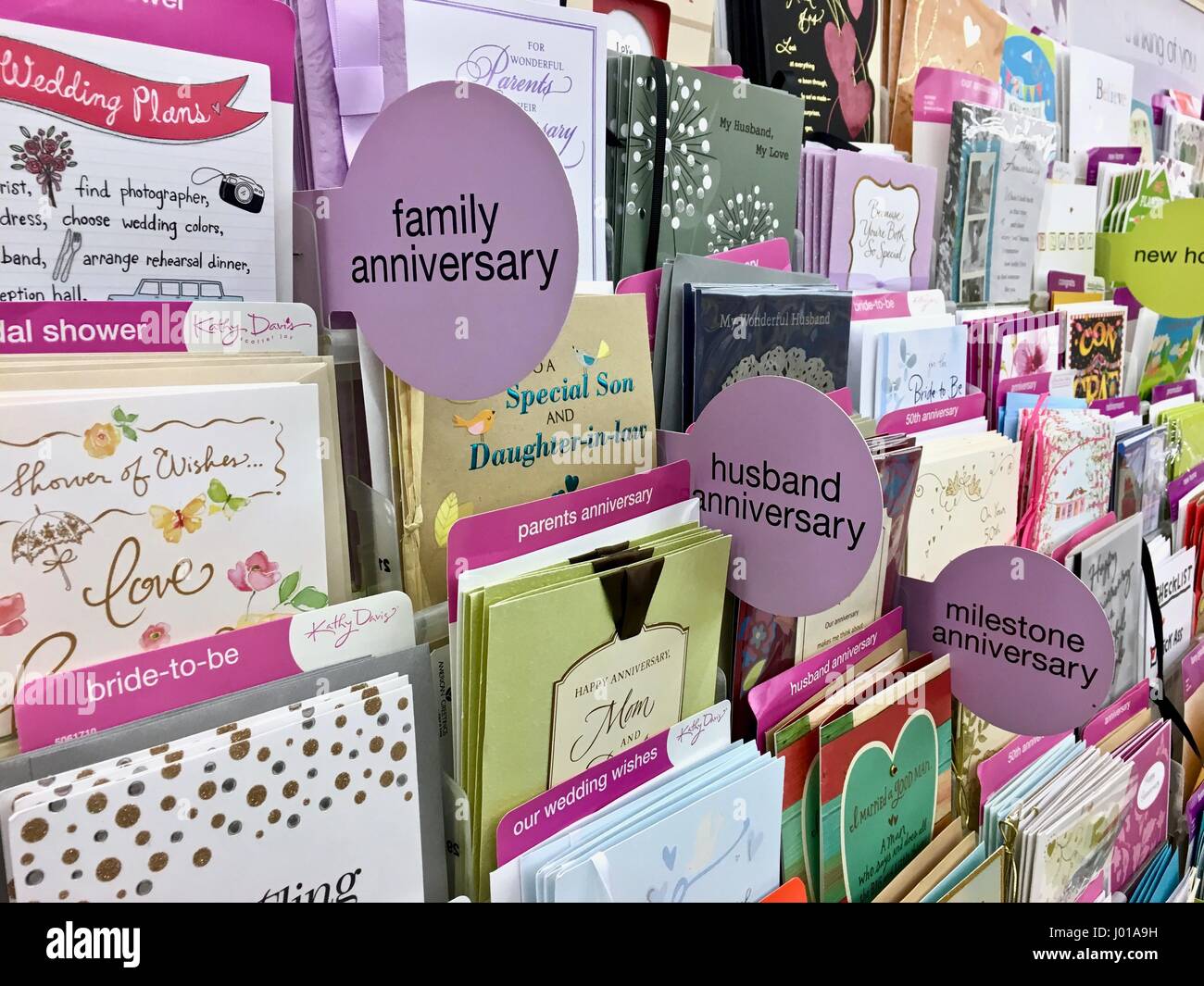 Greeting cards, birthday cards, romantic cards, get well cards, holiday cards at a grocery store card shop Stock Photo