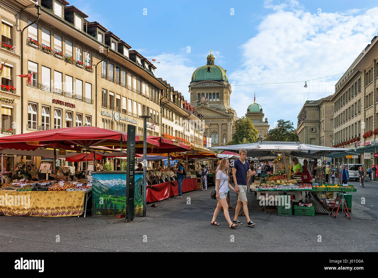 Bern, Switzerland - August 31, 2016: People on the market at Bundesplatz with Swiss Parliament building on the background, in the old city center of B Stock Photo