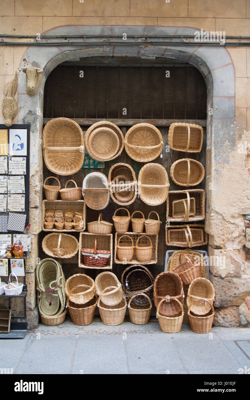 SEGOVIA, SPAIN - FEBRUARY 11, 2017: Wicker hand-made baskets at the shop of a touristic street of Segovia, Castilla and Leon, Spain. Stock Photo