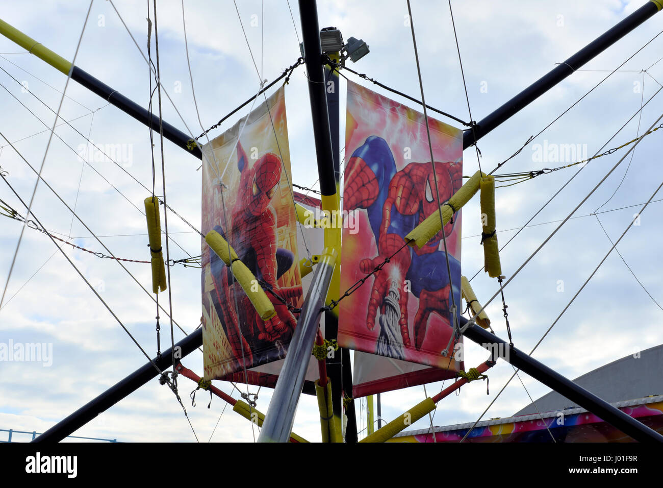 Spider-Man in the web at the rides against a pastel beautiful sky Stock Photo