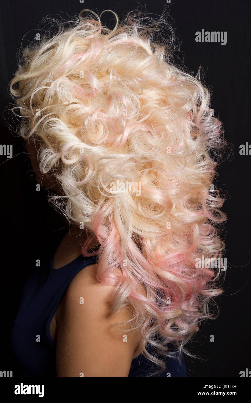 Rear view of a hairstyle. Blond hair with pink highlights Stock Photo -  Alamy